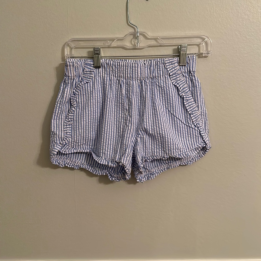 Crew cuts, blue seersucker shorts with ruffles